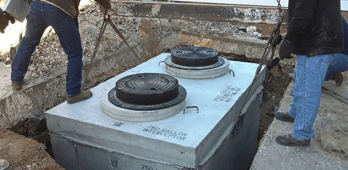 Grease trap installation for a commercial property drainage system in Manchester, NH