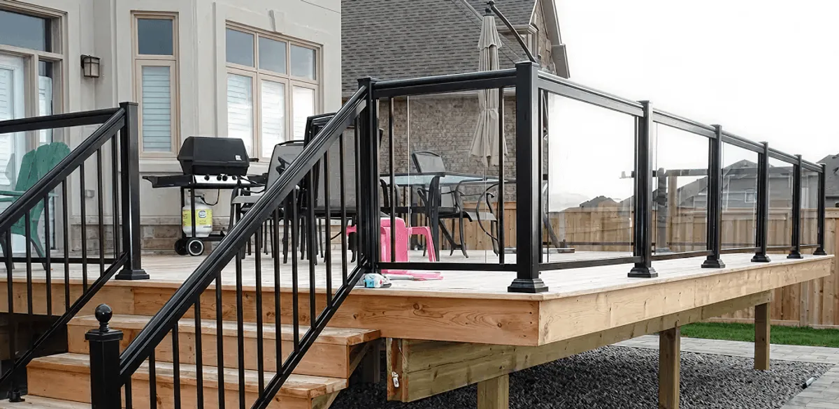 Handrail installation on a deck staircase for safety and code compliance in Manchester, NH