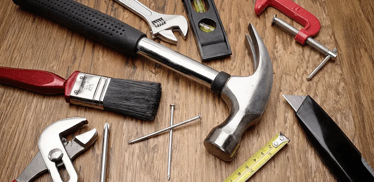 Handyman tools laid out for home repair and maintenance work in Manchester, NH